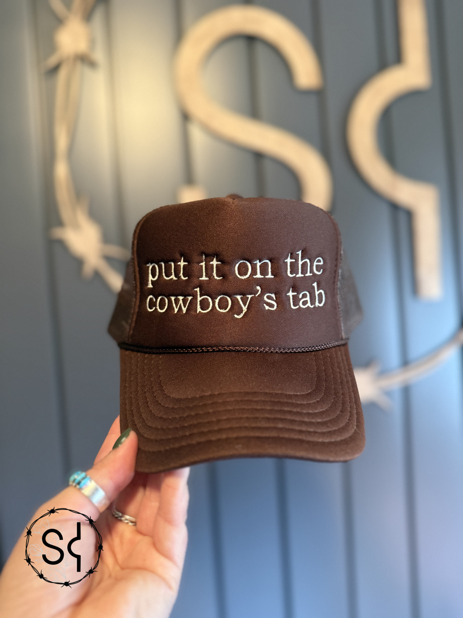 Put it on the Cowboy's Tab Trucker Hat